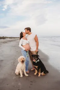 Charleston Beach Maternity Photographer -- Expectant parents pose for Maternity Photos on Folly Beach, SC.
