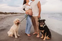 Charleston Beach Maternity Photographer -- Expectant parents pose for Maternity Photos on Folly Beach, SC.