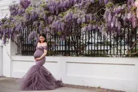Maternity Photos in Charleston, SC -- Expectant mother poses for Maternity Portraits on Meeting Street in downtown Charleston, SC.