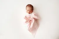 Newborn Infant posed for Newborn Portraits at Holy City Babies Portrait Studio in Charleston, SC.