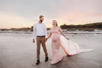 Charleston Beach Maternity Photographer -- Expectant parents pose for Maternity Photos on Folly Beach, SC.