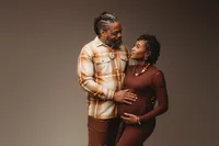 Expectant parents pose for studio Maternity Portraits at Holy City Babies Portrait Studio in Charleston, SC.