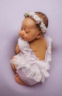 Infant posed for Newborn Baby Photos at Holy City Babies Portrait Studio in Charleston, SC.