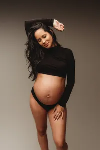Pregnant mother poses for Fine Art, Editorial Style Studio Maternity Portraits in Charleston, SC.