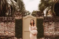 Maternity Photos in Charleston, SC -- Expectant mother poses for Maternity Portraits on Meeting Street in downtown Charleston, SC.