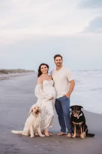 Charleston Beach Maternity Photographer -- Expectant parents pose for Maternity Photos on Folly Beach, SC.