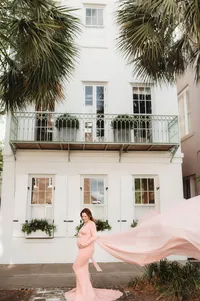Maternity Photos in Charleston, SC -- Expectant mother poses for Maternity Portraits on East Bay Street in downtown Charleston, SC.