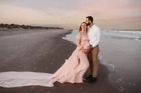 Charleston Beach Maternity Photographer -- Expectant parents pose for Maternity Photos on Folly Beach, SC.
