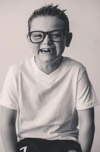 Young boy smiles at the camera during Personality Portrait Photoshoot in Charleston, SC.
