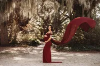 Maternity Photos in Charleston, SC -- Expectant mother poses for Maternity Portraits at Hampton Park in downtown Charleston, SC.