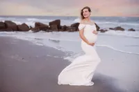 Expectant mother poses for Maternity Portraits on Folly Beach.