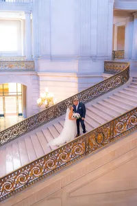 san francisco city hall bride and groom on romantic fairytale stairs