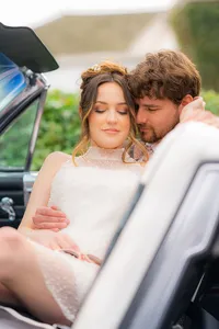 bride and groom embracing in classic car at hollins house in santa cruz