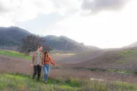 mt diablo summit mountainside couple in open field for engagement photos in bay area california.