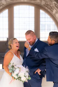 san francisco city hall groomsmen and emotional groom