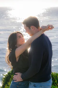 Sunset sparkling ocean couple engagement photos on santa cruz cliffside