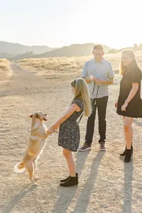 Outdoor candid family image with dog by Suzanne Karp Photography in Fairfax California