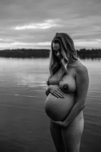 Fine-art maternity portrait photographed in a natural outdoor setting near Durham, NC.
