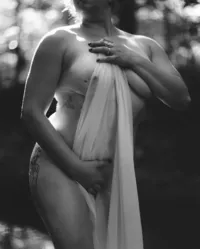Fine art boudoir portrait photographed on film with a soft, editorial approach.
