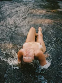 Woman photographed in a natural setting during an outdoor Goddess boudoir session in the Triangle.