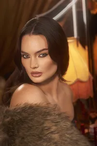 Caitlin Lawson wearing elegant makeup for the Charlotte Tilbury campaign, with vibrant tones, shot by Ylva Erevall.