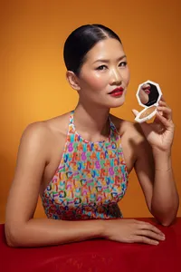 Danielle Yu in a vibrant, colorful portrait, highlighting her bright personality and radiant makeup, captured by Ylva Erevall.