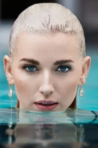 Melissa Goodwin in a crisp, professional portrait, exuding confidence and elegance, captured by Ylva Erevall.