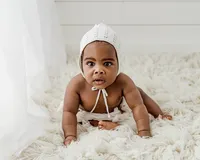 baby boy in a watson studio having his milestone pictures taken