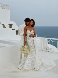 u7533872169_intimate_couple_embrace_on_a_whitewashed_balcony_ha_28bbb22d-65e0-41d9-9c37-e09be7e8a36e (1)