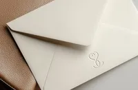 Envelope with an embossed SS monogram