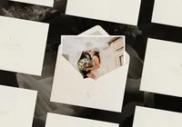 Envelope with a wedding photography image inside, showing an EL monogram for a photographers branding