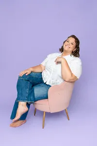 WishboneDesignStudio-Owner-SittingPinkChair