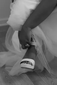 bride in Winston-Salem puts on her shoe