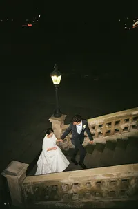 Romantic night portrait of a bride and groom at Letenský zámeček in Prague, captured on film with a timeless atmosphere.