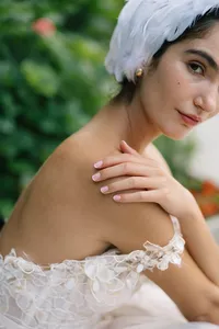 Close-up of lace gown detail and model’s shoulder captured in Lake Como editorial