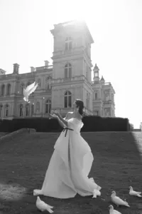 Bride silhouetted against a Paris skyline at dusk
