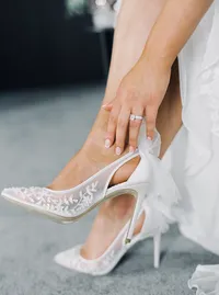 Close-up detail of bride’s shoes, ring, and wedding accessories during preparation for the Lake Oswego Oregon winery wedding.