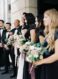 Bridal party standing together holding bouquets during a romantic winery wedding in Lake Oswego Oregon.