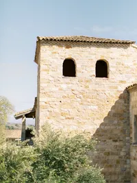 Sunstone Winery stone architecture surrounded by vineyards in Santa Ynez Valley California.
