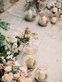 Ceremony flowers and vintage hand-blown candle holders at Sunstone Winery wedding ceremony.