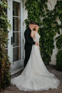 Bride and groom posing together at luxury private estate wedding in Vancouver, Washington.