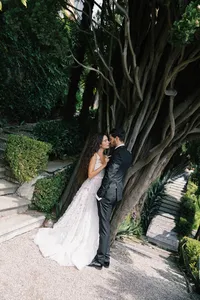 Bride portrait framed by historic villa garden