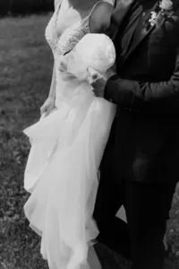 Bride’s flowing gown moving through estate garden during Vancouver, Washington private wedding.