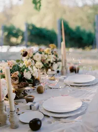 Elegant wedding table styling with garden roses, deep fruit tones, silk linen overlay, organic dinnerware, and modern pink glassware at a Lake Oswego Oregon winery wedding reception.