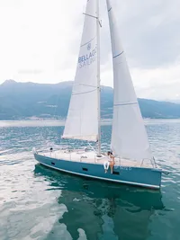 Couple aboard private sailboat during Lake Como elopement