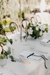 Ivory velvet linen tablescape with black ribbon detail at private estate wedding in Vancouver, Washington.