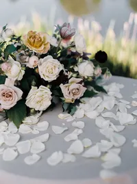 Garden rose bouquet and flower petals styled for the ceremony signing table at a romantic Lake Oswego Oregon winery wedding.