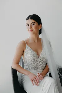 modern romantic bride seated portrait in wedding dress and vail