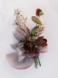 Close-up of groom boutonniere for Sunstone Winery wedding.