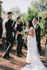 Bridal party congratulating the bride and groom after their outdoor ceremony at a romantic winery wedding in Lake Oswego Oregon.